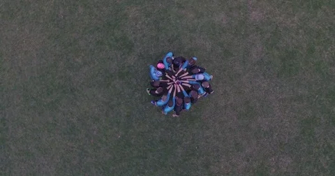 Aerial of player having team huddle in ground 動画素材 77335984