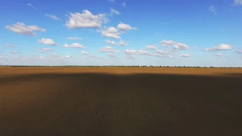 AERIAL: Plowed field Video stock 83320723