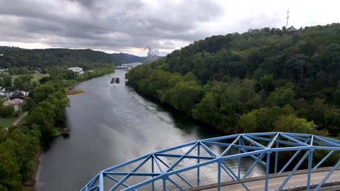 Aerial Point Marion, PA reverse flight over bridge with power plant in distance Stock Footage 323936057