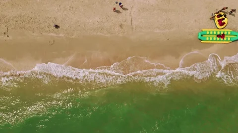 Aerial point of view to sandy seaside with resorts, sun umbrellas and Stock Footage 144529315