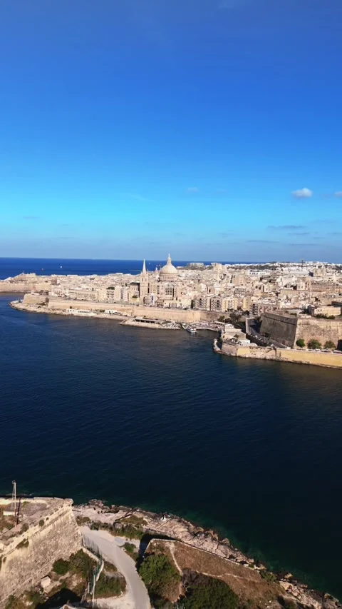 Aerial portrait low angle wide drone shot panning of valletta Malta in summer Stock Footage 335295397