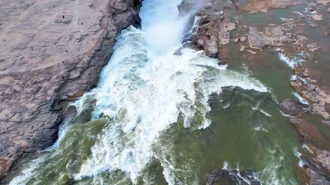 Aerial Powerful River Currents Through Rocky Terrain at Hukou Waterfall Video stock 342250380