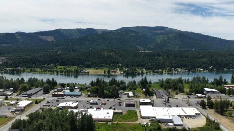 Aerial of Priest River small mountain town with riverfront community Stock Footage 337598264