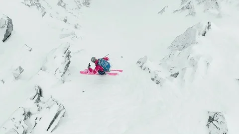 Aerial of professional skier going down snowy mountain carefully in French Alps Video stock 121595531