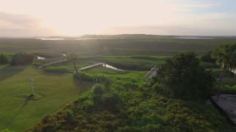 Aerial of property by a marsh Stock Footage 167371851