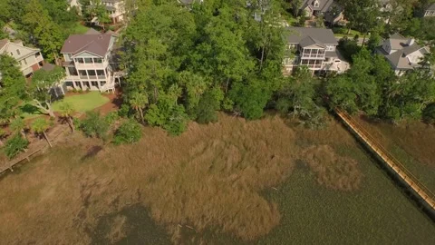 Aerial of property by a marsh Stock Footage 167372048