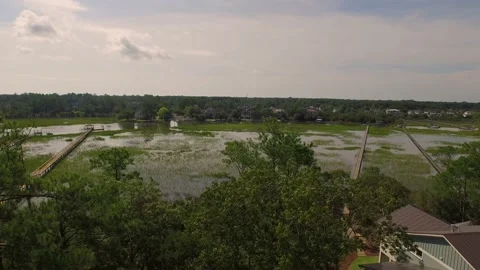 Aerial of property by a marsh Stock Footage 167372069