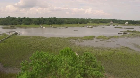 Aerial of property by a marsh Stock Footage 167372102