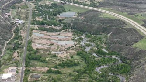 Aerial of Provo River next to Highway 189 in Heber Valley Utah in spring 動画素材 335787256