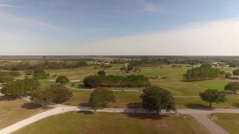 Aerial of Public Golf Course While Man Tees Off, 4K Stock Footage 72605997