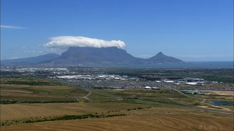 Aerial of puffy white cloud over green landscape, Table Mountain Stock Footage 109448693