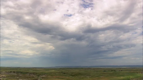 Aerial of puffy white cloud over green grass field, Grassland And Ranches Stock Footage 109450942