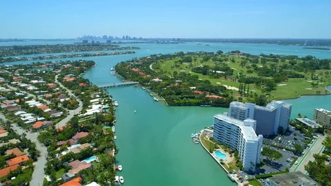 Aerial pull away out establishing shot Miami Beach residential islands Bay Ha Stock Footage 89247703