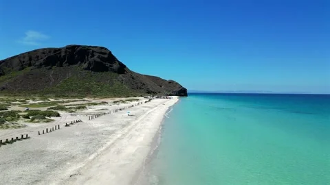 Aerial Pull Away Over the Wave Line at El Tecolote Beach Facing Punta Shiro Stock Footage 340925643