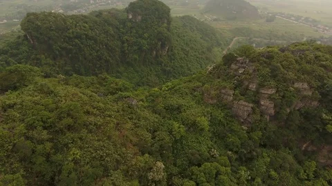 Aerial Pull Away Shot of Bai Dinh mountain at Bai Dinh Temple Spiritual and C Stock Footage 127888324