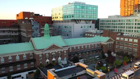Aerial Pull Away Sunset Shot of Montefiore Hospital Center in the Bronx Stock Footage 129795283