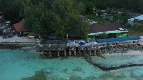 Aerial Pull Away of Waves Over Gili Trawangan Island, Indonesia Stock Footage 125845433