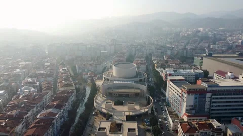 Aerial Pull back of Ahmed Adnan Saygun Arts Center Izmir Turkey 14 Jan 2023 Stock Footage 329335529