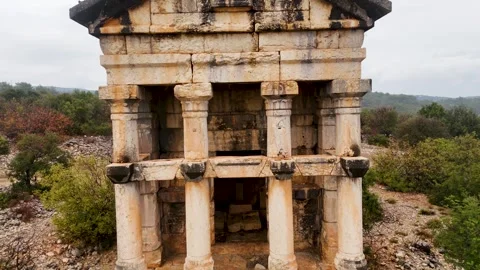 Aerial Pull-Back of Ancient Stone Mausoleum in Natural Landscape, Mersin Stock Footage 324135514
