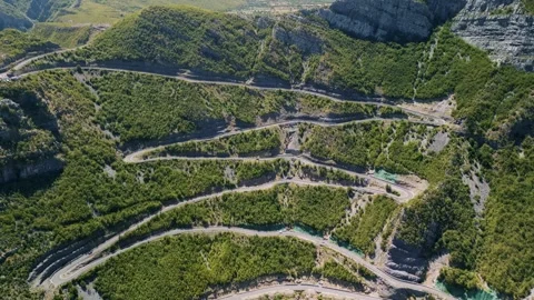 Aerial Pull Back and Tilt Down of SH20 Winding Road in Albania 库存影片 331591868