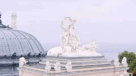 Aerial pull back and wrap around statue on Odessa National Theater 4K Stock Footage 122529715
