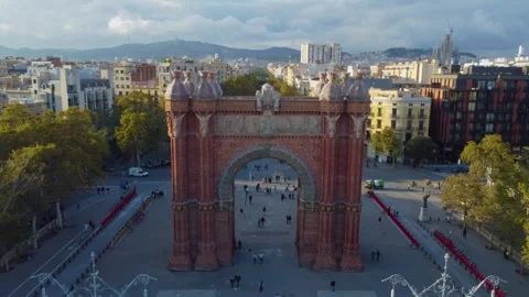 Aerial pull back from Arc de Triomf at sunset in Barcelona Stock Footage 328385081