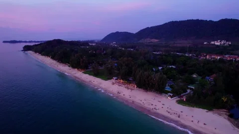Aerial pull back from beach at dusk Stock Footage 347990233