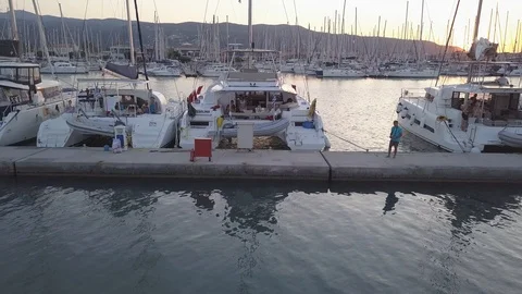 Aerial pull back boats at sunset in Lefkada marina Stock Footage 120296519