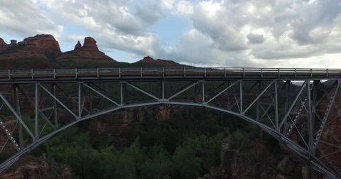 Aerial pull back from a bridge in desert landscape Video stock 57925011