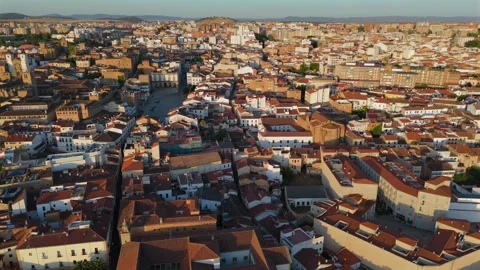 Aerial pull back from Caceres main square and medieval old town at sunrise Stock-Footage 342321352