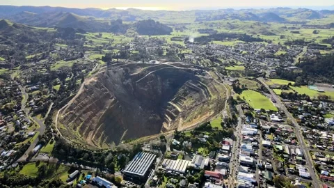 Aerial pull back from closed gold mine with visible big slip in New Video stock 156722021