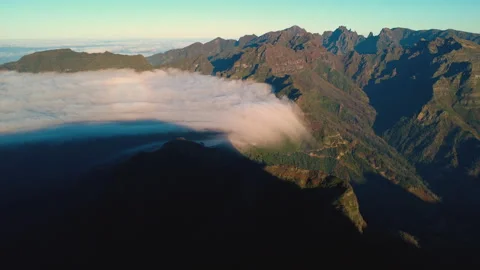 Aerial pull back from cloud waterfall and Sao Vicente valley, Madeira Vídeos de archivo 328639701