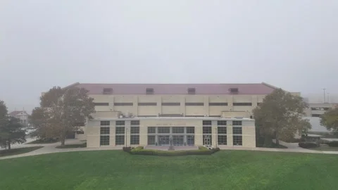 Aerial Pull-Back From a Fog-Shrouded Allen Fieldhouse Video stock 337970247
