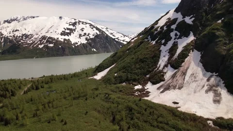 Aerial Pull Back From Glacier Lake As Snow Melts 스톡 동영상 170165723