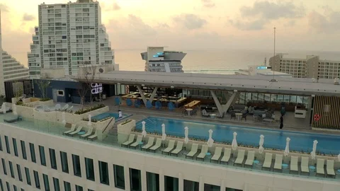 Aerial pull back from Hilton hotel and La Isla in cancun, mexico at sunrise Stock Footage 127209137