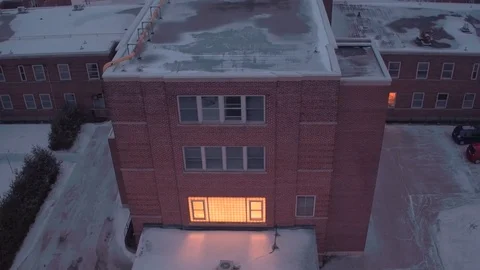 Aerial pull back from hospital in winter Stock Footage 72547460