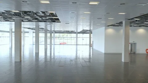 Aerial pull back inside huge deserted office building Stock Footage 107305331