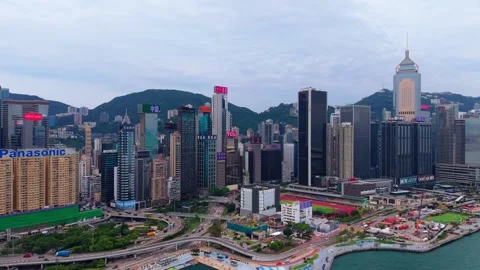 Aerial pull back over Hong Kong high-rise skyscrapers ramp traffic and Wan Chai Stock Footage 336341350