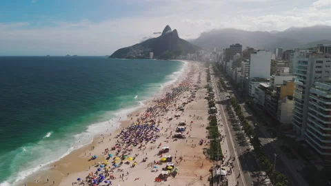 Aerial Pull-Back Over Ipanema Beach Umbrellas, Rio de Janeiro Video stock 309996898