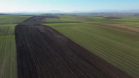 Aerial Pull-back Over Patchwork Agricultural Fields, Greece Stock Footage 332084888