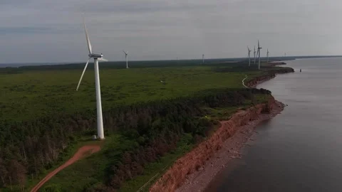 Aerial Pull Back Over Red Cliffs, Trail, Turbine, North Cape PEI Stock Footage 341363280