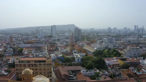 Aerial pull-back over Santo Domingo Plaza and old town Cartagena Colombia Stock Footage 127238489