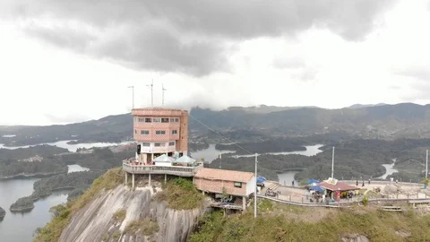 Aerial Pull Back From Piedra Del Penol Rock In Guatape Medellin 動画素材 96772426
