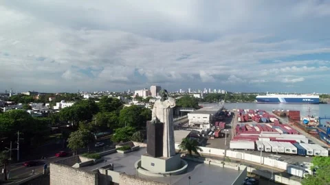 Aerial Pull Back Reveal from Antón de Montesinos Statue to Industrial Shipping Stock Footage 336286135