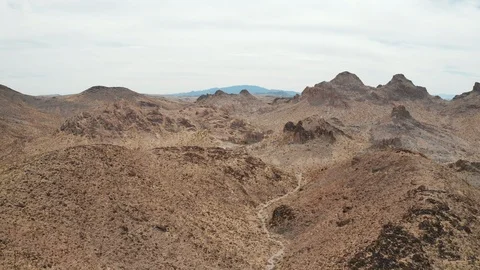 Aerial Pull Back Reveal Shot of Mojave Desert Mountain Landscape near Las Vegas Stock Footage 116606401