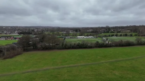 Aerial Pull Back Revealing Avery Hill Park and Football Pitches Stock Footage 335904824