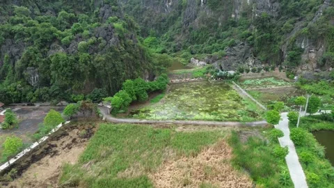 Aerial Pull-back Revealing Endless Limestone Karst Peaks in Ninh Binh Vietnam Stock Footage 326664231