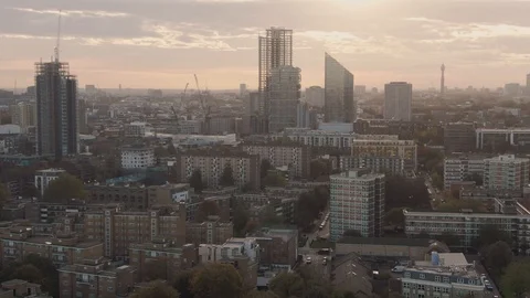 Aerial pull back revealing view of the skyline of central London from the North Stock Footage 97384040