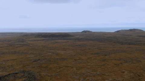Aerial pull back revealing view of a volcanic crater in Iceland Stock Footage 115712629