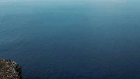 Aerial pull back revealing view of wrecks of boats in Lampedusa (Italy) Stock Footage 118947120